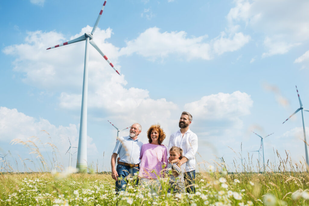 multigeneration family standing on field